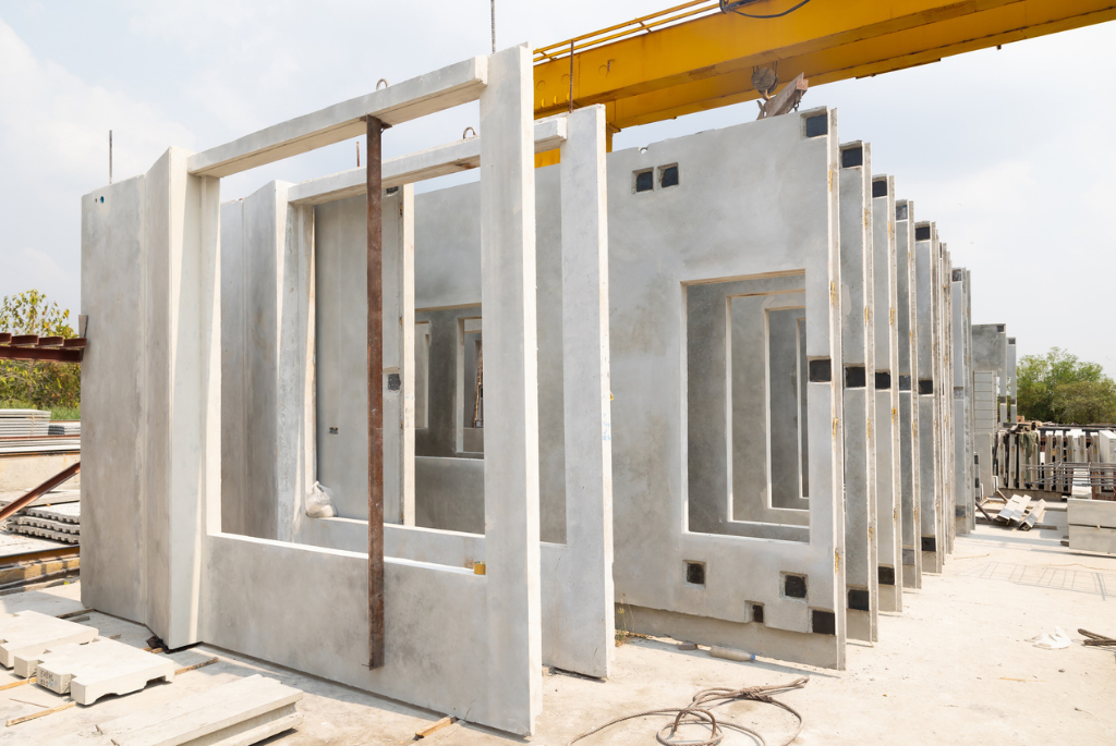 Precast modular wall panels staged on-site for residential construction, helping builders streamline material logistics and reduce on-site labor