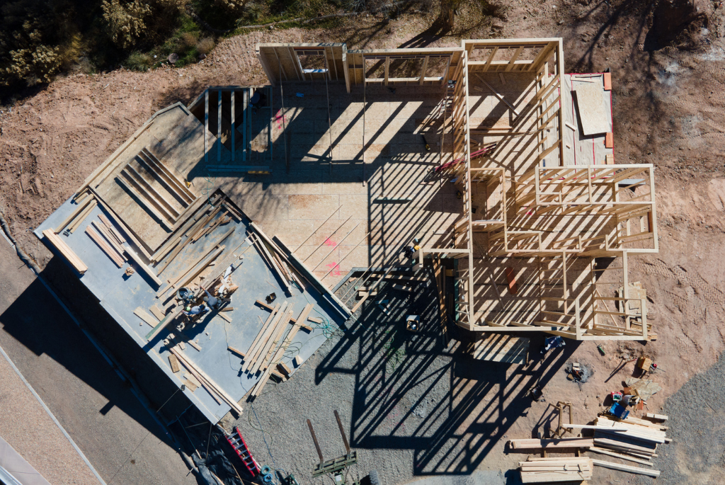 Aerial view of a residential construction site in framing stages