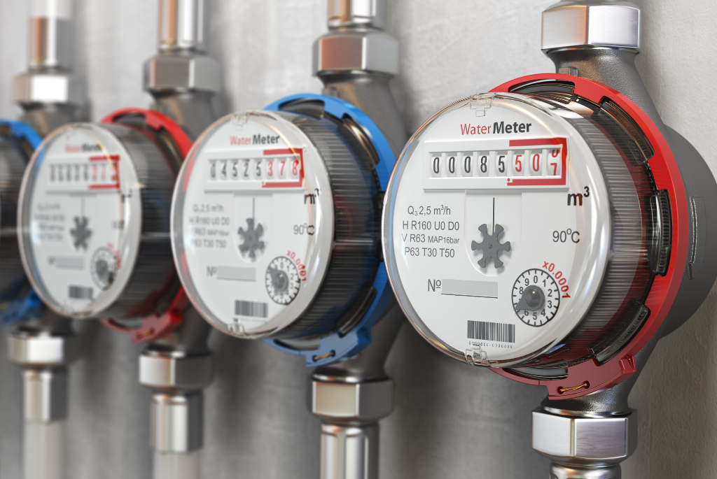 Smart water meters installed on building plumbing lines to monitor water usage and support efficient water management in high-density housing.