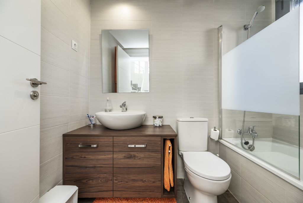 Modern prefabricated apartment bathroom with modular fixtures and compact layout installed in a multifamily residential unit.