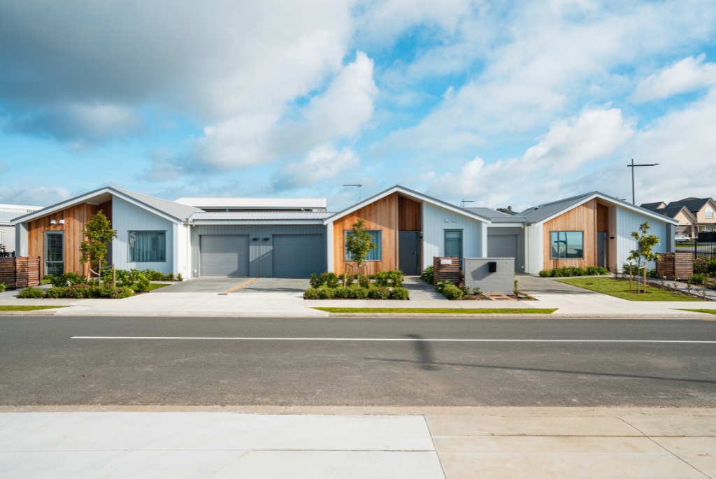 Modern entry-level single-family homes in a newly developed residential neighborhood with simple, efficient exterior designs.