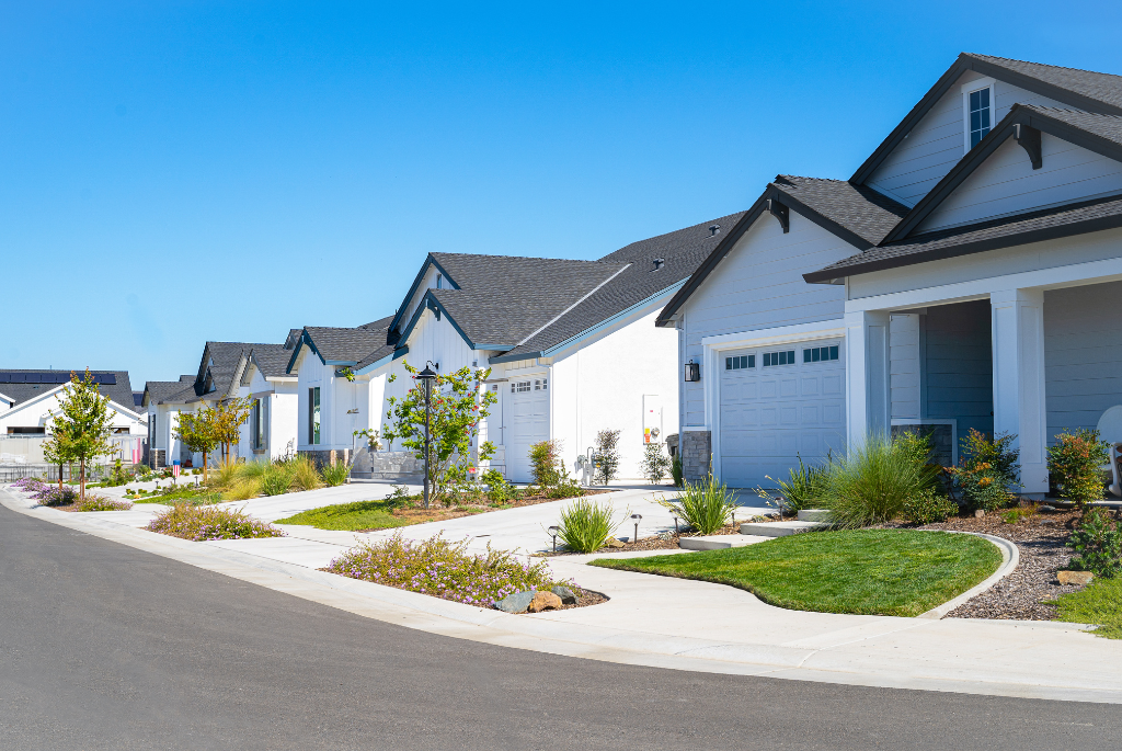 Modern entry-level single-family homes in a suburban neighborhood featuring compact layouts, efficient landscaping, and smart space design.