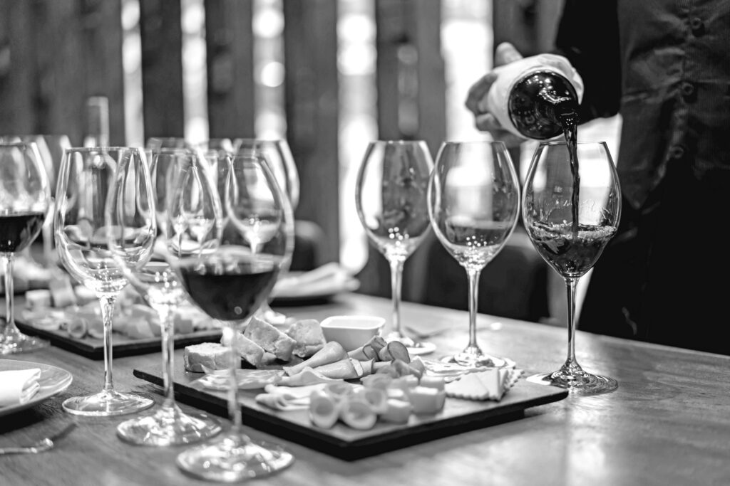 Sommelier serving glasses of winetasting event